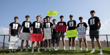 Friends of Emerson Colindres, who was recently deported, show their support. Megan Jelinger / Reuters.