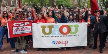 United Academics of Ohio University members with banner