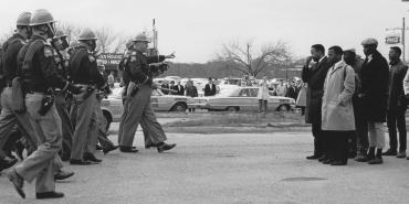 John Lewis (foreground, at right) in Selma, Ala., on March 7, 1965, before he and other voting rights activists were beaten by state troopers on what became known as “Bloody Sunday.” Credit: Courtesy of U.S. Department of State, GPA Photo Archive