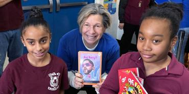 Weingarten, center, with students Kaylyn R. and Saniya M., at P.S. 48 in the Bronx on Feb. 8.