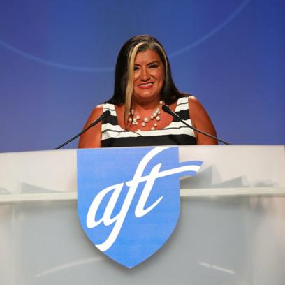 Evelyn DeJesus stands at aft podium