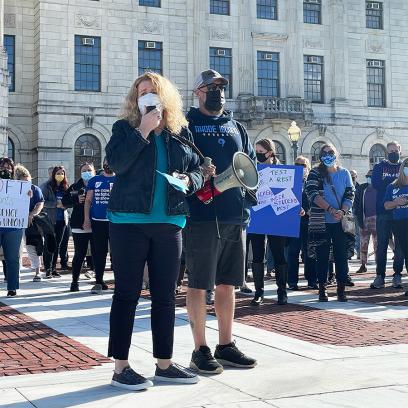 speakers at the providence teachers union rally