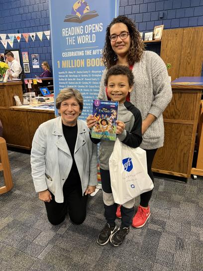 Photo: Jayveon, a 3rd grader at Cloud Elementary with his mother, Victorya and AFT President Randi Weingarten at a Reading Opens the World event with AFT Kansas and United Teachers of Wichita.
