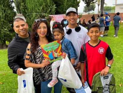 Photo of family at the El Rancho Federation of Teachers Reading Opens the World event