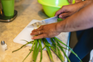 Photo of person chopping vegetables