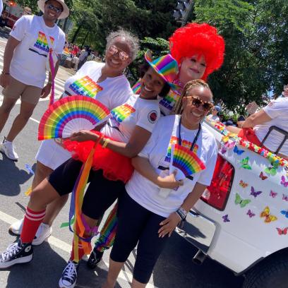 WTU President Jacqueline Pogue Lyons, wearing colored hat, with WTU members.