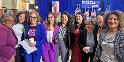 AFT President Randi Weingarten poses for a picture with a group of activists