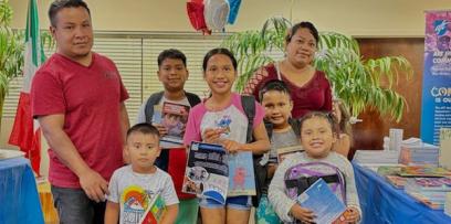 Families like this one enjoyed the community fair and free books.
